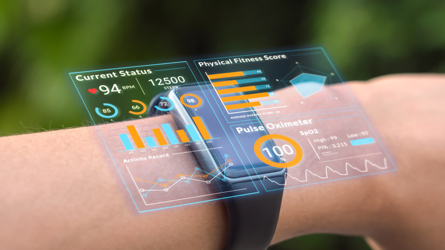 a hand wearing a watch. This shows the health data of the person on a holographic display.