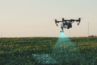 A drone wich flys obove a filed with crops and scans it with infrared